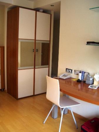 The bureau and desk in the studio apartment
