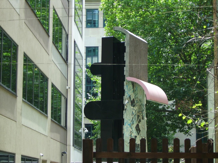 Dark side of 'neon' sculpture in garden.