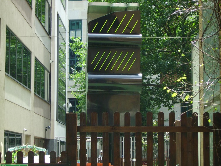 Neon Sculpture in Garden, revolving on a podium.