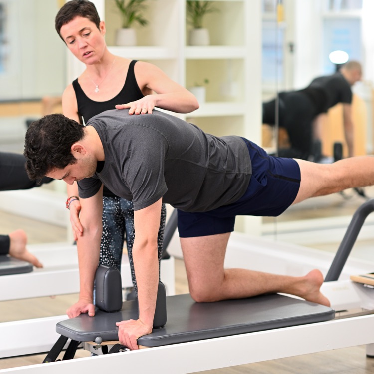 Pilates quadruped on the Reformer