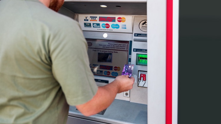 Customer using Post Office ATM