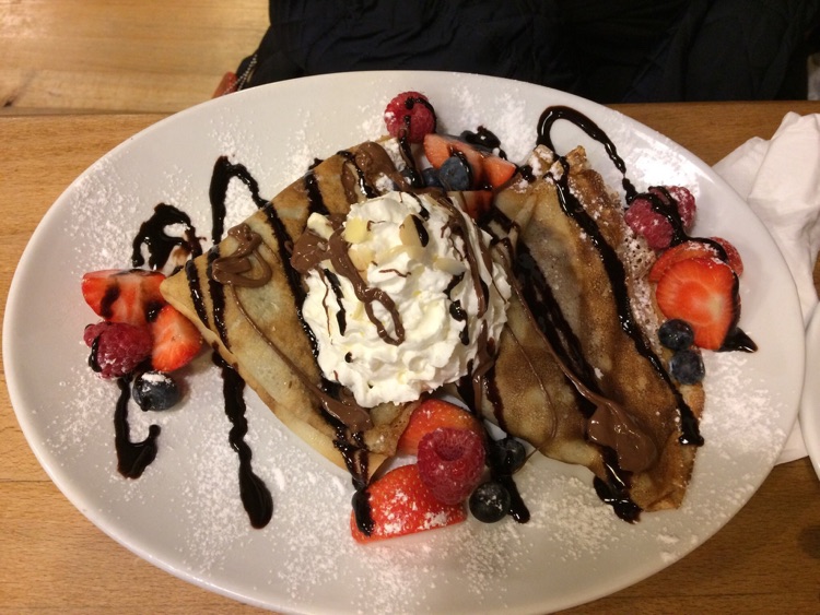 Crepes with almond and Nutella. Best breakfast ever! Serves all day!