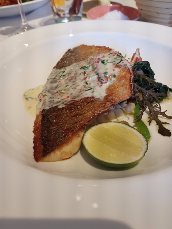 Sea bream with white beans, chilli and lime