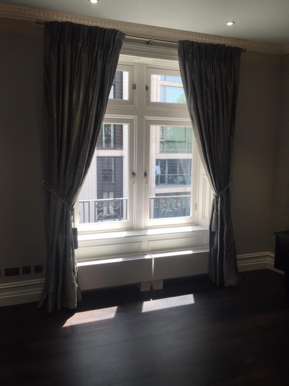 Silk, triple pinch pleat curtains.