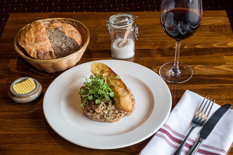 Steak Tartare - Prepared at the table, the way you like it with Toasted baguette & Crispy leaf s