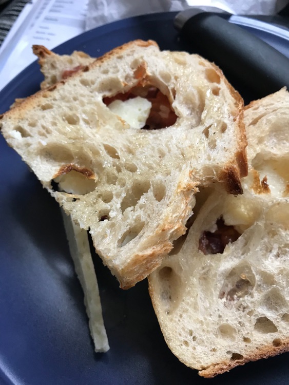 Dry bread with holes, barely any ingredients.