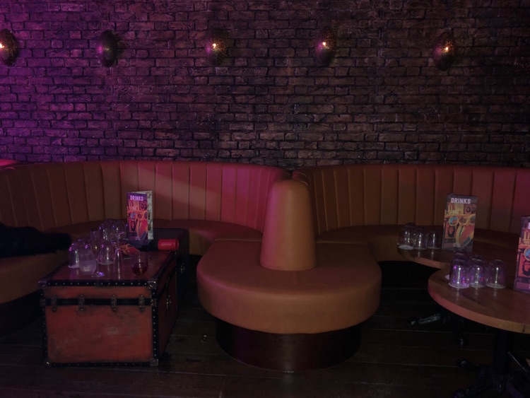Empty tables - no one is allowed to sit.