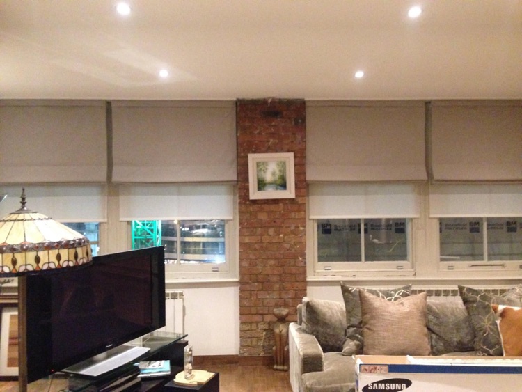 Four roman and roller blinds.