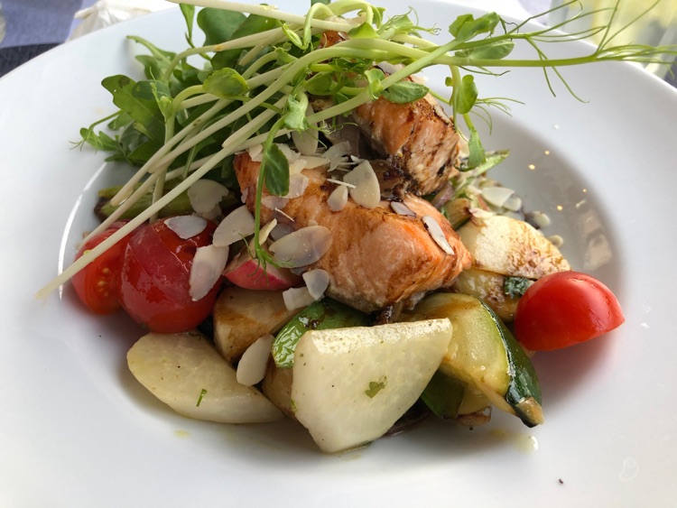 Glazed Salmon over a slightly crunchy vegetable ragout. The best dish we had.
