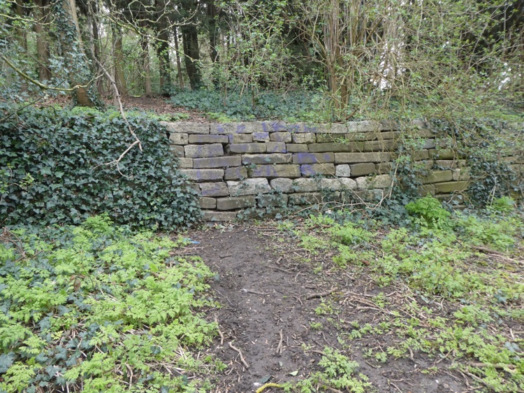 Brenchley Garden, Honor Oak, South London: restored granite embankment along the former railway