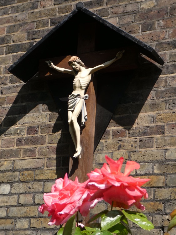 The Church of Saint Mary the Virgn, Rotherhithe: crucifix on church exterior
