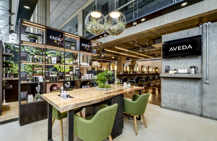 As you step inside, you'll notice the Aveda Lifestyle Salon & Spa's unique look, which features reused wood sourced from Canadian riverbeds.