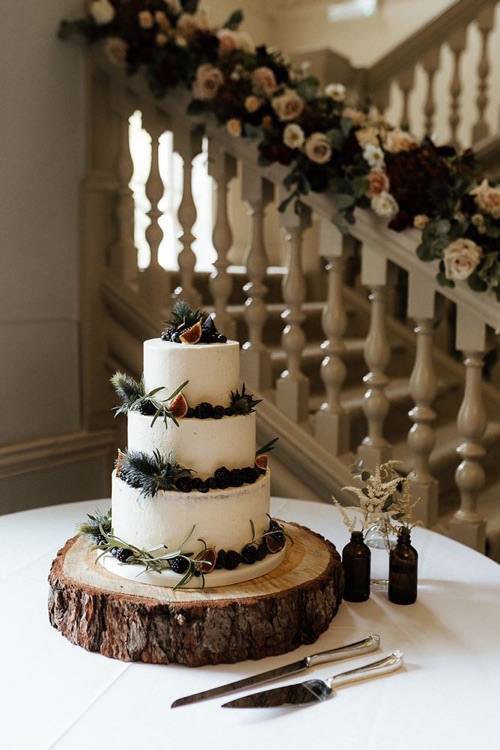 3 tier Buttercream iced cake decorated with thistles and seasonal fruit