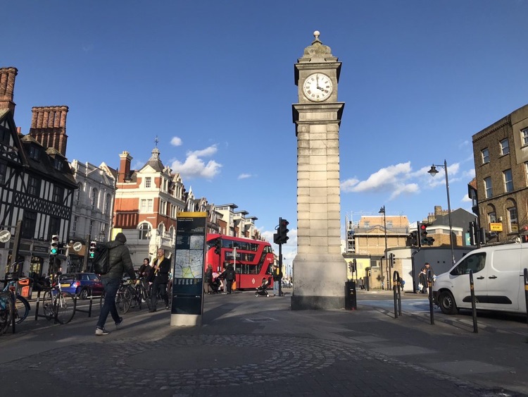 A sunny day at the underground station street level entrance at Clapham Common.